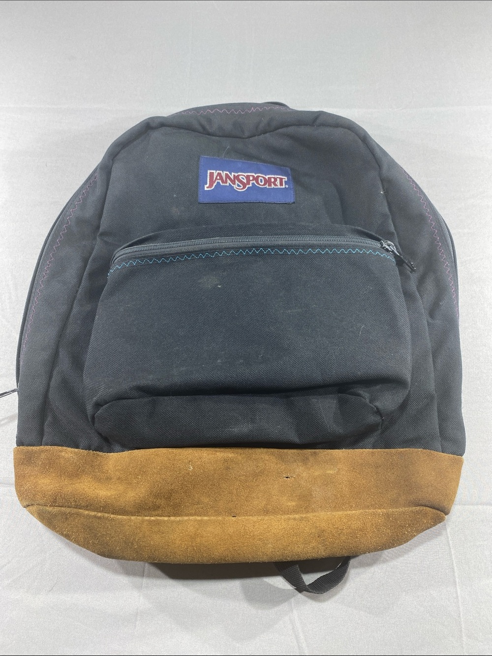 Jansport Black Backpack with Brown Suede Base and Blue Logo
